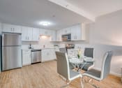 Thumbnail 8 of 24 - our modern kitchen and dining room with white cabinets and stainless steel appliances