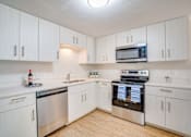 Thumbnail 7 of 24 - kitchen with stainless steel appliances. microwave, dishwasher, range