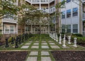 Thumbnail 34 of 39 - a large chess set in front of an apartment building