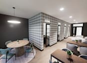 Thumbnail 11 of 21 - A modern dining area with a round table and chairs.