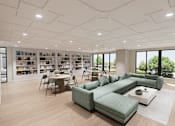 Thumbnail 14 of 21 - A modern living room with a green sofa set and a bookshelf filled with books.