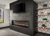 Thumbnail 24 of 61 - a living room with a fireplace and a tv on the wall