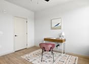 Thumbnail 30 of 53 - A room with a desk and chair.