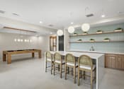 Thumbnail 26 of 26 - A modern kitchen with a pool table.