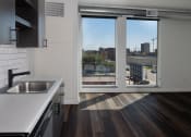 Thumbnail 37 of 84 - A kitchen with a sink and a window at The Landing at 1001 NP, Fargo, North Dakota, 58102