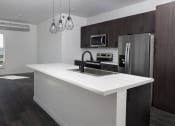 Thumbnail 19 of 84 - Kitchen with cabinets at The Landing at 1001 NP, Fargo, ND 58102