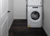 Thumbnail 12 of 17 - Stacked washer and dryer in laundry closet at The Avery - Residential Apartments, Fargo, ND