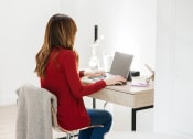 Thumbnail 31 of 84 - Woman Working From Home at The Landing at 1001 NP, Fargo, North Dakota, 58102