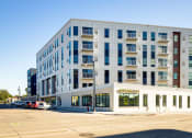 Thumbnail 4 of 27 - a new apartment building on the corner of a city street at Riverhouse Apartments, North Dakota