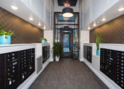 Thumbnail 31 of 50 - a view down the hallway of a large white office with a black door at the end of  at Dillard Apartments, Fargo, ND, 58102