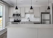 Thumbnail 1 of 60 - Kitchen at Kesler Apartments in Downtown Fargo, North Dakota, 58102