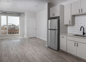 Thumbnail 5 of 60 - Kitchen with cabinets at Kesler Apartments in Downtown Fargo, Fargo, North Dakota 58102