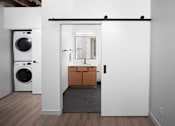 Thumbnail 13 of 26 - Laundry Room at Bostad Apartments, Fargo, ND 58102