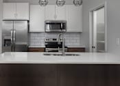 Thumbnail 24 of 29 - Modern Kitchen at Mercantile on Broadway, Fargo, North Dakota 58102