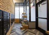 Thumbnail 12 of 37 - a room with a chevron floor and a whiteboard on the wall  at RoCo Apartments, Fargo, ND, 58102