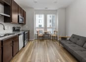 Thumbnail 25 of 37 - a kitchen and living room in a 555 waverly unit  at RoCo Apartments, Fargo, ND 58102