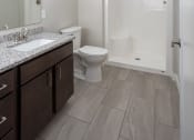 Thumbnail 37 of 37 - a bathroom with a toilet sink and shower  at RoCo Apartments, Fargo, ND 58102