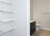 Thumbnail 33 of 37 - a bathroom with a toilet and a sink  at RoCo Apartments, Fargo, ND 58102
