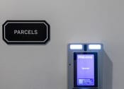 Thumbnail 47 of 84 - an electronic device on a wall next to a sign at The Landing at 1001 NP, Fargo, ND 58102