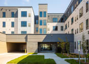 Thumbnail 72 of 84 - a view of the front of the building on a sunny day at The Landing at 1001 NP, Fargo, ND, 58102