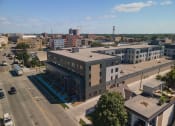 Thumbnail 73 of 84 - an aerial view of a large building in a city at The Landing at 1001 NP, Fargo, ND 58102