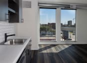 Thumbnail 57 of 84 - a kitchen with a sink and a window at The Landing at 1001 NP, Fargo, North Dakota, 58102