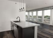 Thumbnail 63 of 84 - a kitchen with a large window and a sink at The Landing at 1001 NP, Fargo, ND 58102