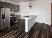 Thumbnail 65 of 84 - a kitchen with a large island and stainless steel appliances Landing at 1001 NP, Fargo, ND, 58102