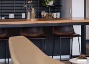 Thumbnail 75 of 84 - a chair is sitting in front of a table at The Landing at 1001 NP, Fargo, ND 58102
