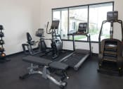 Thumbnail 78 of 84 - a gym with treadmills and other exercise equipment at The Landing at 1001 NP, Fargo, North Dakota, 58102