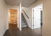 Thumbnail 24 of 36 - A hallway with a staircase leading to the second floor. at Unite Apartments, North Dakota, 58103