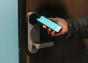 Thumbnail 8 of 37 - a person holding a cell phone in their hand  at RoCo Apartments, Fargo, North Dakota 58102