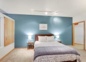 Thumbnail 10 of 86 - a room with a bed and a table and geometric patterns on the wall