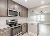 Thumbnail 38 of 39 - Kitchen breakfast bar with granite countertops