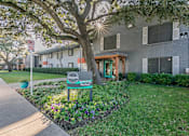Thumbnail 1 of 31 - Chapel Creek Apartments exterior with landscaped walkways in Dallas