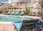 Thumbnail 17 of 25 - our apartments have a resort style pool and lounge chairs