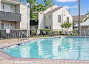 Thumbnail 2 of 11 - A pool surrounded by a fence with a no diving sign.