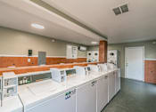 Thumbnail 9 of 31 - Laundry Facility at Chapel Creek Apartments in Dallas
