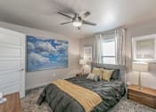 Thumbnail 3 of 30 - Stylish bedroom with ceiling fan and natural light at Reserve on Abrams Dallas
