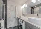 Thumbnail 22 of 30 - Laundry with combo washer and dryer