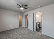Thumbnail 24 of 30 - Stylish bedroom with ceiling fan and natural light at Reserve on Abrams Dallas