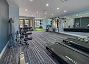 Thumbnail 20 of 24 - Fitness center with treadmills and weights – Borders Apartments Brownsville TX