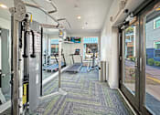 Thumbnail 11 of 30 - 24-hour fitness center with cardio and strength equipment at Reserve on Abrams