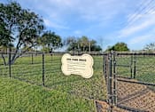 Thumbnail 7 of 15 - A sign in a dog park outlines the rules for using the area.