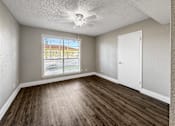 Thumbnail 2 of 24 - One Bedroom with vinyl flooring and ceiling fan – Borders Apartments Brownsville TX