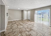 Thumbnail 7 of 24 - Large dining room with tile flooring – Borders Apartments Brownsville TX