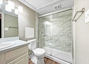 Thumbnail 21 of 28 - Bathroom with modern vanity and bright mirror lighting at Verano Oaks
