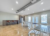 Thumbnail 24 of 28 - Clubhouse seating area with modern décor and polished flooring