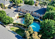 Thumbnail 13 of 23 - an aerial view of a house with a swimming pool and bridge