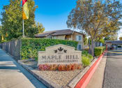 Thumbnail 1 of 29 - an image of the maple hill apartments sign in front of the building